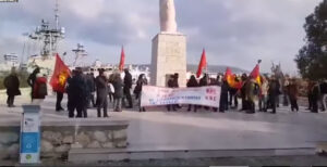 Greek communists carry out a protest action against NATO ship